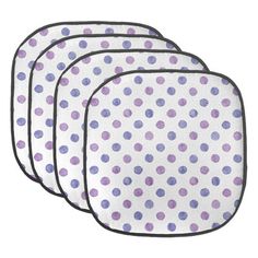 four purple and white polka dot placemats