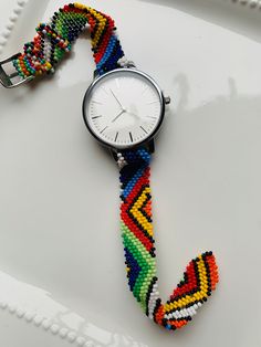 A unisex watch adorned in Zulu beads. Make a statement in this unique piece. With an adjustable strap Gift Gift Gift Handmade Multicolor Watch Accessories For Gift, Multicolor Bracelet Strap Watch As Gift, Beaded Adjustable Watch Accessories For Gift, Multicolor Watches With Bracelet Strap As Gift, Adjustable Beaded Watch Accessories As Gift, Casual Multicolor Watch Bands As Gift, Beaded Watch Bands, Zulu Beads, Beaded Watches