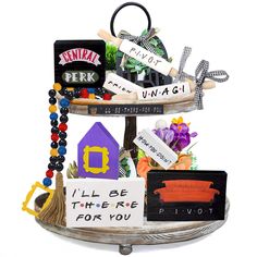 there is a three tiered tray with magnets and other things on it that say i'll be there for you