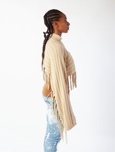 Give your look a western edge and add a wide-brimmed hat! Wear it on its own as a top or layer over a slip dress or camisole and jeans. For a breezy poncho version, see our Olympia Poncho. Oversized western crop top in multi-ladder stitch with mock neck, long kimono sleeves & asymmetrical fringe accents. 5% WOOL 20% NYLON 20% AC 55% POLY Style #G889 Bohemian Knit Tops With Fringe, Black Bohemian Handwoven Poncho, Bohemian Halter Top With Built-in Bra, Summer Poncho With Fringe, One Size, Casual V-neck Top With Fringe, Mock Neck Crop Top, Ladder Stitch, Long Kimono, Kimono Sleeve