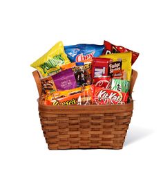 a brown basket filled with lots of candy and snacks on top of a white background