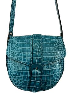 Patricia Nash Padova Croc Embossed Leather Crossbody Saddle Bag-Blue Coral-NWT-Orig. Price $249.00                                HAS ORIGINAL TAG & DUST BAG Patricia Nash Padova Saddle Bag Color: Blue Coral Croc Size/Profile: Petite saddle bag Walls: Full-grain leather Trim/Embellishments: Heavy stitching Handles/Strap: Adjustable, flat leather crossbody strap Exterior: Rear slip pocket-Metal studs Closure: Flap top with magnetic snap closure and buckle Lining/Trim: Faux suede Interior: Large f Blue Travel Saddle Bag, Blue Luxury Leather Saddle Bag, Blue Leather Saddle Bag For Daily Use, Luxury Blue Leather Saddle Bag, Blue Crossbody Saddle Bag With Detachable Strap, Blue Saddle Shoulder Bag, Blue Formal Bag With Adjustable Handle, Blue Formal Bags With Adjustable Handle, Blue Formal Shoulder Bag With Adjustable Handle