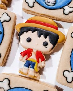 cookies decorated like cartoon characters are on display