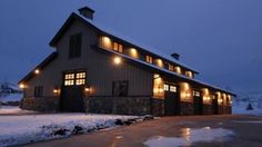 a large building with lights on it in the snow