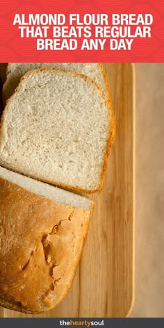 a loaf of bread sitting on top of a wooden cutting board