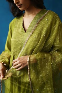 Green kurta with contrasting color panels, zari silk woven yoke, and dainty accents on the neck and sleeves. Paired with pant and checkered stole. - Aza Fashions Green Handloom Anarkali Set, Festive Celebration Fusion Sets, Fusion Style Self-design Dupatta, Pista Green Semi-stitched Silk Kurta, Green Semi-stitched Cotton Silk Kurta, Semi-stitched Pista Green Silk Kurta, Semi-stitched Pista Green Dola Silk Kurta, Green Semi-stitched Dola Silk Kurta, Anamika Khanna