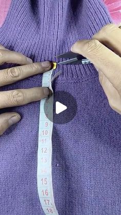 a woman measuring her waist with a pair of scissors and tape on top of it