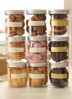 several jars filled with different types of cookies