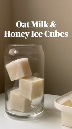 cubes of soap sit in a glass on a table