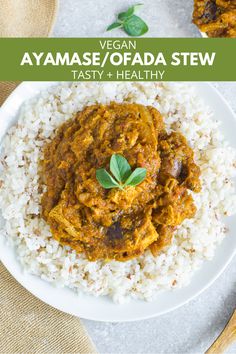 a white plate topped with rice and curry