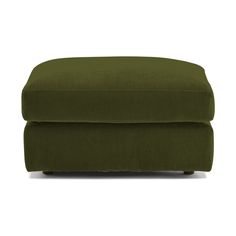 a green footstool on a white background