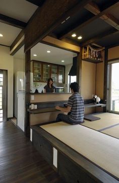 a person sitting at a counter in a room