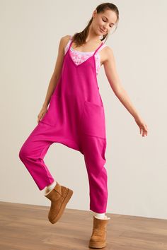 Instantly elevate your athleisure looks with this jumpsuit, perfect for all seasons. Guaranteed to be a new go-to, this one-piece features a slouchy style with front pockets, a v-neckline, and cozy relaxed fit. Pair with your favorite sports bra or strappy tank for the coolest fit for all your travel days. Football Dress, Athleisure Looks, Football Homecoming, Football Tops, Slouchy Style, Skirts With Boots, Cool Fits, Altar'd State, Dress Romper