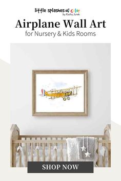 the airplane wall art for nursery and kids rooms is displayed in front of a baby's crib