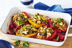 a casserole dish filled with stuffed bell peppers