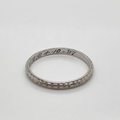 A fine Art Deco period band ring.  In platinum.  With alternating engraved diamond and circle decoration around the band.  Simply a wonderful period wedding ring!  Date: Early 20th Century  Overall Condition: It is in overall good, as-pictured, used estate condition.  Condition Details: There is some rubbing and high point wear to the engraved decoration. Otherwise, there are some fine & light surface scratches and other signs of expected light wear consistent with age.  Fineness: Marked PLATINU Classic White Gold Diamond Ring With Decorative Band, Classic Platinum Rings With Decorative Band, Heirloom Diamond Ring With Decorative Band, Round Cut, Heirloom Round Cut Diamond Ring With Decorative Band, Classic Silver Diamond Ring With Decorative Band, Classic White Gold Stackable Rings With Decorative Band, Engraved White Gold Diamond Ring In Platinum, Anniversary Diamond Ring In White Gold With Decorative Band, Heirloom Rings With Decorative Round Band