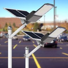 two street lights with solar panels on them