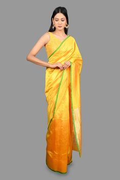 Canary yellow banarasi handloom saree crafted in pure chanderi silk with bloom buta woven details and contrasting green border detailing. Comes with an unstitched blouse piece. - Aza Fashions Designer Yellow Slub Silk Traditional Wear, Yellow Tissue Silk Pre-draped Saree For Navratri, Yellow Slub Silk Traditional Wear With Resham Embroidery, Traditional Yellow Slub Silk Wear With Resham Embroidery, Yellow Traditional Wear With Resham Embroidery In Slub Silk, Transitional Designer Yellow Pre-draped Saree, Yellow Handloom Pre-draped Saree For Navratri, Yellow Handloom Pre-draped Saree For Wedding, Festive Yellow Tussar Silk Pre-draped Saree