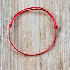 Karma and Luck Red String Bracelet A wonderful gift to give to family members, new couples, best friends, wedding or engagement and many more! *Made with high quality 1mm satin cord *They are adjustable, and one size fits most.   *They are 100% handmade and made in non-smoking environment. Red string bracelets are believed to provide help and love to everyone around them. This has been a movement and so many people including Leonardo DiCaprio, Madonna, Miley Cyrus, Nicole Richie, Rihanna, Demi Moore, Britney Spears, Zac Efron, Lauren Conrad, Chris Brown are part of this. You, too, can make a difference by becoming a part of this movement by wearing one of the red string bracelets!  It is said that the left side of the body is the receiving side, so wearing it on the left side allows the re Red Personalized Friendship Bracelets, Personalized Red Friendship Bracelets For Everyday, Personalized Red Friendship Bracelets, Everyday Personalized Red Friendship Bracelets, Red Adjustable Bracelets For Everyday, Adjustable Red Bracelets For Everyday, Personalized Red Jewelry For Promise, Red Bracelet With Sliding Knot For Valentine's Day, Red Sliding Knot Bracelet For Valentine's Day