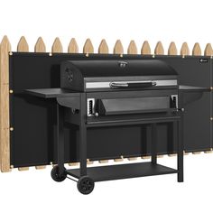 an outdoor bbq grill with wheels on the side and a wooden fence behind it