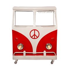 a red and white vw bus with peace sign on it's front window