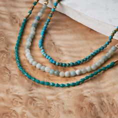 A vivid long array of natural Amazonite stones beaded with blue jasper stones, quartz crystals, and gold beads to form a classic wrap-around look. Material: Natural Amazonite Stone, Blue Jasper Stone, Quartz Crystals, and Gold Plated Beads Length: 25" to 27" Adjustable Blue Jasper, Blue Stone Necklace, Amazonite Necklace, Watch Engraving, Bracelet Apple Watch, Amazonite Stone, Gold Wrap, Quartz Crystals, Jasper Stone