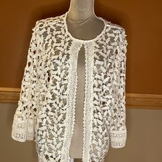 Lace/Embroidered Cardigan Never Worn Cream Floral Embroidery Cardigan For Spring, Cream Floral Embroidered Cardigan For Spring, Spring Lace Open Knit Blouse, Spring Lace Blouse With Open Knit, Elegant Embroidered Spring Cardigan, Elegant Spring Open Knit Outerwear, Elegant Open Knit Outerwear For Spring, Spring Floral Embroidery Open Front Cardigan, Open Knit Top With Open Front For Spring