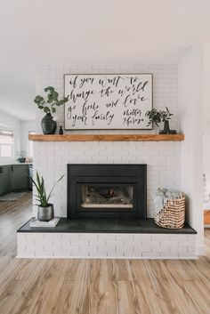 a living room with a fire place and wooden floors