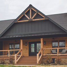 the front porch of a house with wooden steps leading up to it's entrance