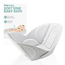 the baby bath seat is in front of a box