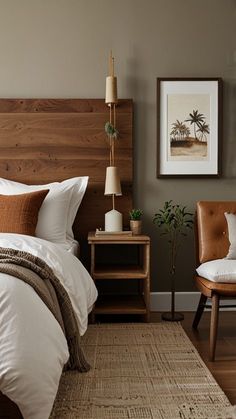 a bed room with a neatly made bed and two chairs next to the headboard