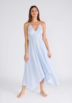 Freshen up your warm-weather wardrobe with our versatile halter neck beach dress in a breathable cotton gauze fabrication. This show-stopping style features a plunging v-neckline and a handkerchief hemline. The long straps can be tied in multiple ways, making it the most versatile dress in your closet. Airy cotton gauze Sleeveless Maxi length Handkerchief hemline V-neckline Halter neck Open back Cross back detail Long straps can be tied in multiple ways Model is 5'9, wearing a size S/M.Style: I- Summer Flowy V-neck Halter Dress, Chic V-neck Spaghetti Strap Beach Dress, Chic Spaghetti Strap V-neck Beach Dress, Flowy V-neck Halter Dress For Beach, Breezy V-neck Beach Dress For Daywear, Beach V-neck Sundress In Maxi Length, Breezy V-neck Sundress For Beach Season, Beach Sundress V-neck Maxi Length, V-neck Sundress For The Beach In Maxi Length