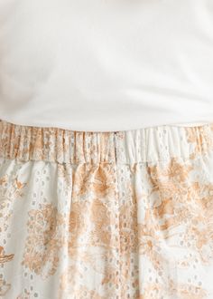 With it’s eyelet lace detail and soft floral pattern, the Annette Eyelet A-line Skirt is a beautiful a-line skirt with a flat front waist and elastic back! This skirt is fully lined with white eyelet lace and a cognac brown floral pattern. Pair this beautiful modest skirt with a t-shirt or sweater in any season. She is grace, beauty and style all in one! Style | A-line, Maxi Color | Cream, Cognac Brown SIZING TIPS Fit | Semi-Fitted Stretch | Mid-Stretch Model | True to Size Elegant Broderie Anglaise Bottoms For Spring, White Lace Bottoms With Elastic Waistband, Spring Lace Bottoms With Floral Print, Spring Floral Print Lace Bottoms, Spring Tiered Skirt With Broderie Anglaise, Flowy Lace Skirt For Daywear, Lace Flowy Skirt For Daywear, Spring Broderie Anglaise Bottoms For Daywear, Spring Lace Full Skirt