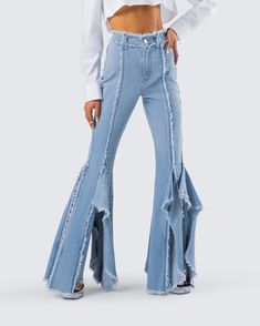 Disco diva 💅 Strut your stuff in these blue frayed jeans constructed from denim fabric and complete with frayed vertical seams and edges, a high-rise fit, and oversized ruffle detailing at the legs 💙 High-rise Denim Blue Flare Jeans With Frayed Hem, High Rise Denim Blue Flare Jeans With Frayed Hem, Chic Dark Wash Pants With Frayed Hem, Chic Denim Cropped Jeans With Frayed Hem, Chic Cropped Denim Jeans With Frayed Hem, Blue Ruffled Bottoms For Fall, Chic Medium Wash Flare Jeans With Frayed Hem, Blue Flare Jeans With Frayed Hem For Fall, Denim Blue Flare Jeans With Frayed Hem