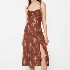 This midi dress features a special shoulder straps and a fitted silhouette, a floral pattern and a dark brown color. Perfect for the early autumn, or pair with a dark shirt and coat for a layered outfit. No Stretch Medium Weight Regular Fit Size runs small,recommend one size up Fabric: 100% Polyester,Lining: 100% Polyester Model is 177cm/5'9" tall, 80cm/31" bust, 59cm/23" waist and 89cm/35" hip and wears a size S. Care Instruction: Hand Wash, Do not bleach, Dry flat in shade, Iron cool (max 110℃ Brown Sundress With Adjustable Straps, Brown Square Neck Dress For Date Night, Brown Spaghetti Strap Dress For Brunch, Brown Midi Dress For Fall Brunch, Brown Spaghetti Strap Brunch Dress, Brown Fall Midi Dress For Brunch, Fall Brunch Brown Midi Dress, Spring Brown Midi Dress With Square Neck, Spring Midi Dress With Square Neck In Brown