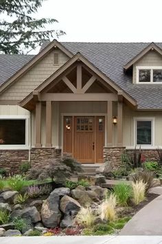 a house that has some rocks in front of it