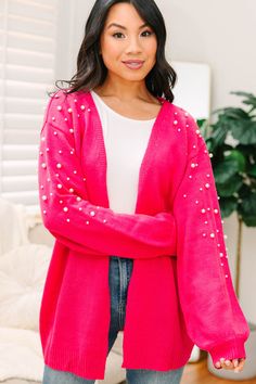 We can't help but love this pearl embellished cardigan! Just look at it! Those little pearls are just so cute and girly! The vibrant coloring is fabulous as well! This cardigan is going to look so good with all sorts of jeans all yeah long! This cardigan features long bubble sleeves, an open front, and pearl embellishments.  Material has a generous amount of stretch.Cindy is wearing the small. Trendy Pink Party Cardigan, Trendy Pink Cardigan For Party, Winter Holiday Outfits, Embellished Cardigan, Floral Cocktail Dress, Black Tie Dress, Long Sleeve Outerwear, Two Piece Swimwear, Friend Outfits