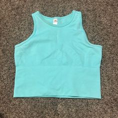 Never Worn- Cyan Blue- Girls L/Xl- Casual Turquoise Stretch Tops, Casual Stretch Turquoise Tops, Basic Blue Cotton Crop Top, Cyan Jewelry, Basic Blue Cotton Tank Top, Sporty Sleeveless Light Blue Tops, Light Blue Cotton Crop Top, Fitted Turquoise Casual Top, Cheap Blue Stretch Cropped T-shirt