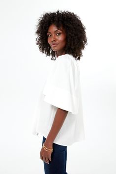 The Finley Flutter Sleeve Top is effortlessly chic. In fresh white cotton, this blouse has a flattering silhouette, oversized flutter sleeves, and a V-neckline. Pair with gold accessories for everything from work to brunch season after season, year after year. V-neckline Oversized flutter sleeves Short sleeves Boxy fit Material: 100% Cotton Care: Hand wash cold, hang to dry Plus And Minus, Cocktail Attire, Flutter Sleeve Top, Gold Accessories, Flutter Sleeves, Pullover Sweatshirts, Fall Trends, Flutter Sleeve, White Cotton