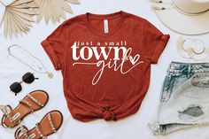 Just a small town girl shirt, country music shirt, country shirt, music lyrics shirt, song lyrics shirt, shirts with sayings, cowboy shirt by Mvsspear on Etsy Fall Letter Print T-shirt For Country Concerts, Trendy Tops For Country Concerts In Spring, Trendy Tops For Spring Country Concerts, Trendy Summer Tops For Country Concerts, Summer Pre-shrunk Ring-spun Cotton Shirt, Casual Spring Tops For Country Concerts, Graphic Tee For Spring Country Concerts, Letter Print Tops For Country Concerts In Fall, Fall Letter Print Tops For Country Concerts