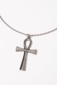 This Stainless Steel Chain Necklace with Ankh Pendant is the perfect blend of style and ancient symbolism. The Ankh pendant, an ancient Egyptian symbol of life, adds a touch of spirituality and cultural significance to this necklace. Whether you're looking to make a fashion statement or simply want to add a meaningful accessory to your collection, this necklace is a great choice. Plus, with its affordable price and versatile design, it makes a great gift for any friend or loved one. Size Length: Spiritual Ankh Necklace With Adjustable Chain, Spiritual Metal Cross Necklaces, Symbolic Ankh Necklace Adjustable, Symbolic Ankh Necklace, Symbolic Ankh Shaped Metal Jewelry, Symbolic Ankh-shaped Metal Jewelry, Symbolic Metal Cross Necklace, Ankh Shaped Metal Necklace As Gift, Ankh Shaped Metal Necklace For Gift