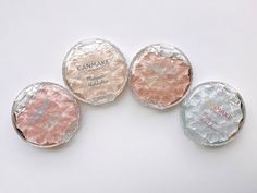 three round candies sitting next to each other on top of a white countertop