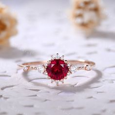 This is 5mm round cut lab ruby engagement ring rose gold. The accent stones are VVS man made cz diamond. The stones can be replace with other gemstones.For example,if you don't like the CZ accent,you can ask me replace it with tourmaline,aquamarine,diamond,emerald,sapphire... For custom making jewelry,it can be made in 2 different metal(Please contact me if you need this one made in solid gold). 1,Solid gold,including 14/18k white/rose/yellow gold. 2,925 sterling silver with white/yellow/rose go Ruby Engagement Ring Rose Gold, Round Ruby Ring, Gold Ring Red Stone, Engagement Rings Ruby And Diamond, Rose Gold Ruby Ring With Halo Setting For Promise, Lab-created Ruby Diamond Ring With Halo Design, Rose Gold Ruby Ring With Brilliant Cut For Promise, Rose Gold Ruby Promise Ring Brilliant Cut, Lab-created Ruby Ring For Proposal