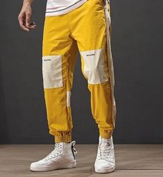 Sweat pants with patches on the knees. Drawstring. COLOR: mustard Yellow White Patchwork Pants For Streetwear, Streetwear Color Block Cotton Bottoms, Color Block Cotton Bottoms For Streetwear, Casual Cotton Color Block Pants, Retro Relaxed Fit Pants For Streetwear, Hip Hop Joggers With Elastic Waistband, Trendy Cotton Jogging Pants, Spring Hip Hop Joggers With Elastic Waistband, Vintage Cargo Pants For Spring Streetwear