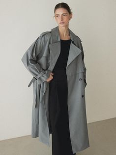 This classic and timeless double trench coat in fog gray offers a stylish and sophisticated look. It features loose oversized silhouette to add appeal to the item.- Long length that makes your outfit stylish- Double flap pattern on the front panel for a dimensional silhouette- Detachable shoulder epaulettes and waist belt for versatile styling Gray Trench Coat Outfit, Grey Trench Coat Outfit, Long Trench Coat Outfit, Trench Styling, Trench Coat Outfits, Gray Trench Coat, Coat Outfit Casual, Long Grey Coat, Shoulder Epaulettes