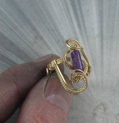 The beauty of the amethyst  gemstone 10x4 mm  amethyst in a gold  setting beautiful workman shop   size 6 1/2 Gold Amethyst Jewelry For Anniversary, Amethyst Crystal Ring In Yellow Gold For Anniversary, Yellow Gold Amethyst Crystal Ring For Anniversary, Gold Amethyst Ring In 14k Gold, Gold Amethyst Crystal Ring With Gemstone, Gold Amethyst Ring With Spiritual Style, Gold Amethyst Jewelry For Promise, Gold Amethyst Ring For Healing, Gold Amethyst Ring Spiritual Style