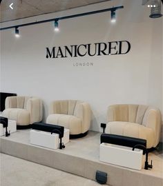 the mancured london store is decorated with white and black furniture