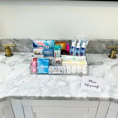 the bathroom counter is full of toiletries and personal care items for someone to use