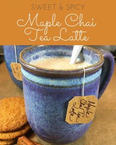 a cup of coffee and some cookies on a table with the words sweet & spicy maple chai tea latte