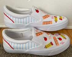 Custom teacher shoes made with a hand-painted design on memory foam slip-on sneakers. Perfect for expressing your love for teaching and showing your creative and colorful side! Custom Teacher Shoes, Painted White Vans, Painted Vans Slip On, Graduation Shoes, White Slip On Vans, Teacher Shoes, Teacher Canvas, Teacher Fits, Fairy Design